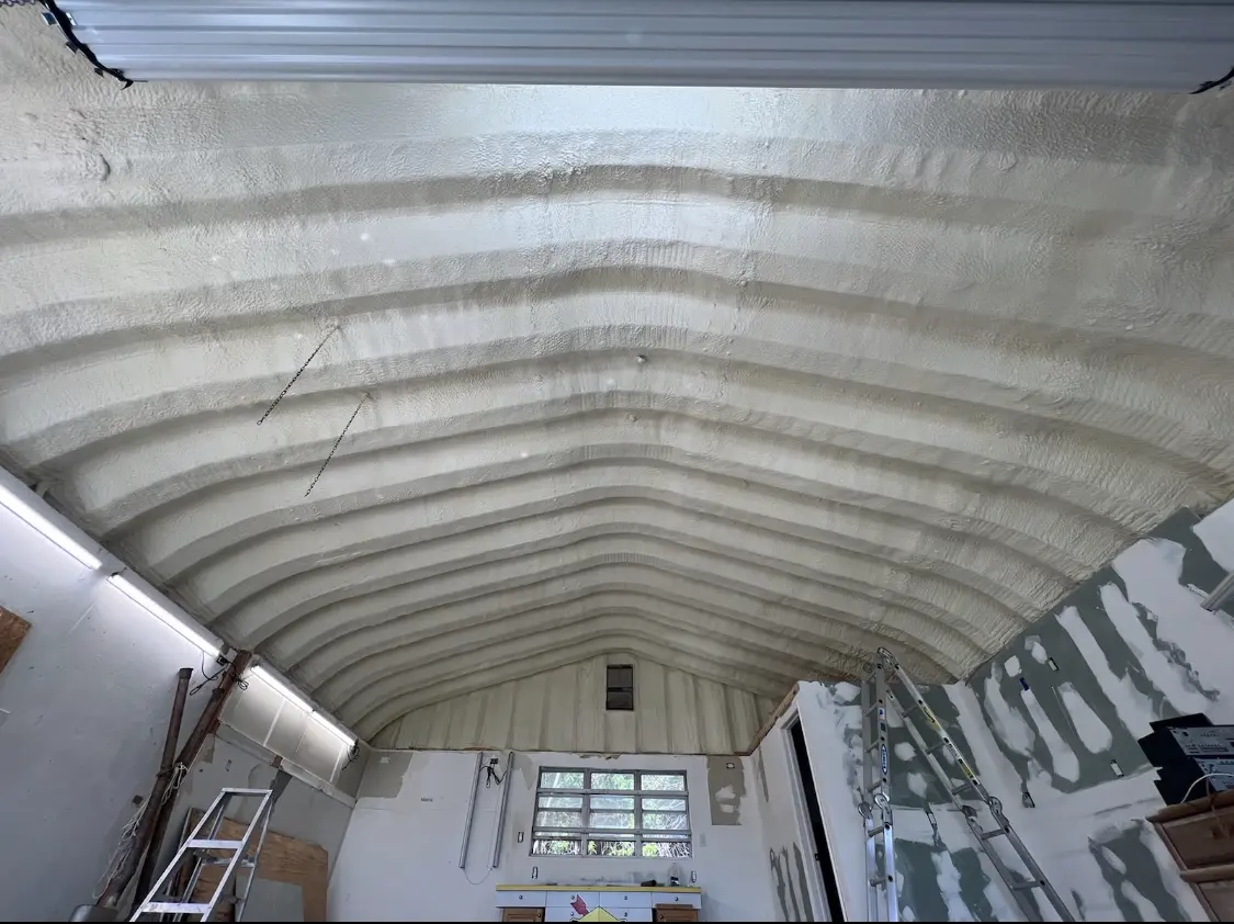 Spray polyurethane foam applied to the underside of a metal roof deck in Liberty Triangle